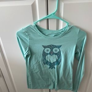 Light blue long sleeve shirt with an owl